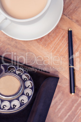 Coffee with old land line and pen