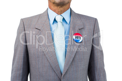 Businessman posing with badge