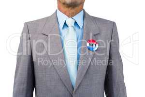 Businessman posing with badge