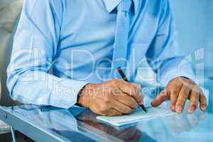 Businessman on his desk signing document