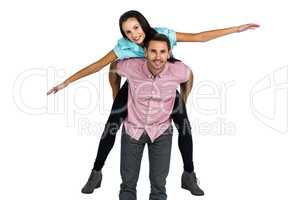 Smiling man with piggy back to his girlfriend