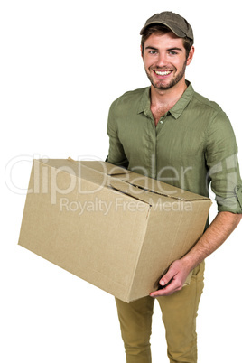 Smiling postman holding package