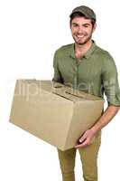 Smiling postman holding package