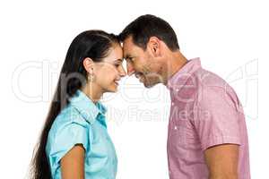 Smiling couple touching foreheads