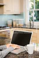 Close up of woman using laptop