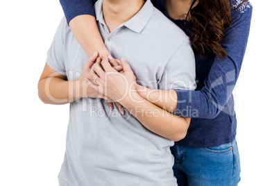 Mid section of loving woman embracing man