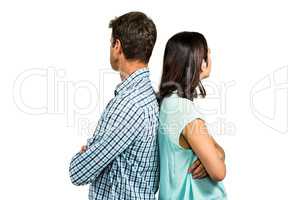 Couple ignoring each other while standing back to back