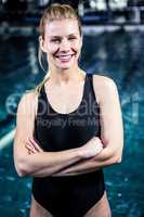 Portrait of a woman swimmer looking the camera