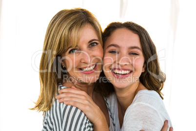 Mother and daughter hugging