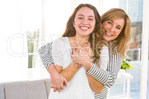 Smiling mother and daughter