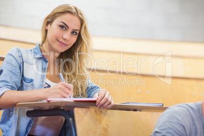 Smiling female student during class