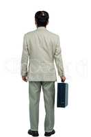 Back turned businessman holding a briefcase