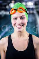 Portrait of a woman swimmer looking the camera