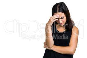 Depressed woman with hand on head