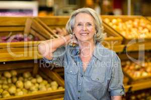 Smiling senior woman at the grocery shop