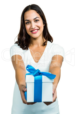 Portrait of young woman giving gift box
