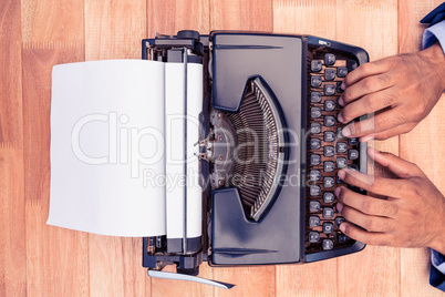 Businessman typing on typewriter