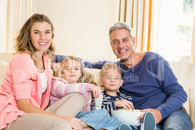 Happy family enjoying a movie together