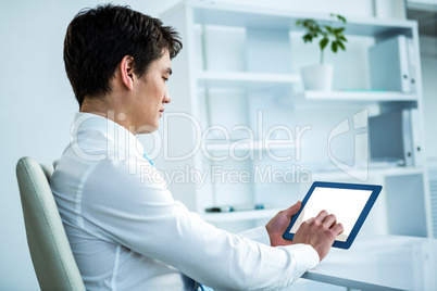 Asian man using tablet