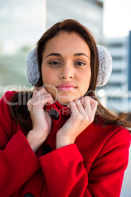 Portrait of women wearing coat and ear muffs
