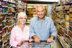Senior couple shopping in grocery store