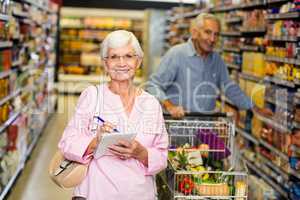 Senior woman with shopping list