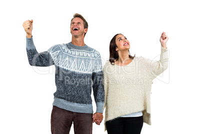 Cheerful couple in warm clothing gesturing