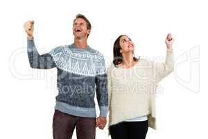 Cheerful couple in warm clothing gesturing