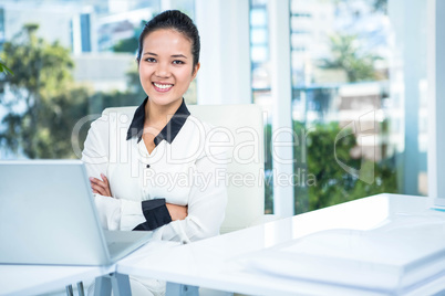 Smiling businesswoman with arms crossed Smiling businesswoman with arms crossed