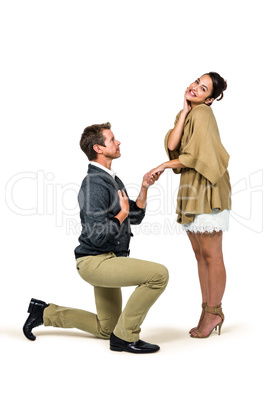 Man proposing woman while kneeling