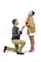 Man proposing woman while kneeling