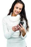 Smiling woman using smartphone