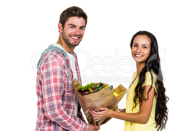 Man offering bouquet to his girlfriend