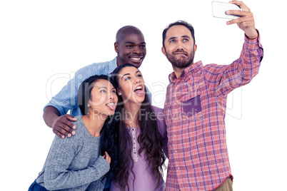 Multi-ethnic friends making face while taking selfie