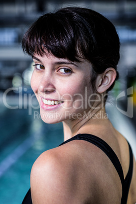 Portrait of a woman swimmer looking the camera