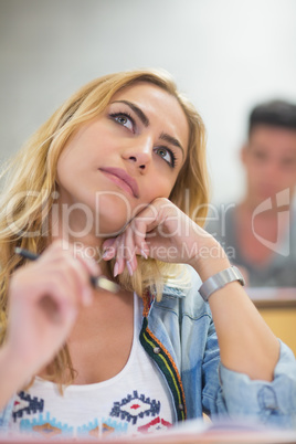 Thoughtful female student during class