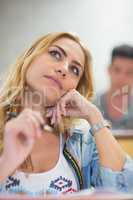 Thoughtful female student during class