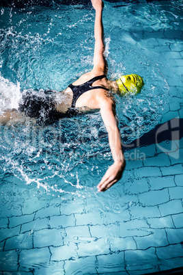 Swimmer woman swimming in the swimming pool