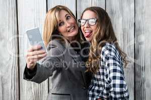 Mother and daughter taking a selfie