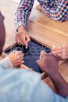 High angle view of business people writing on slate