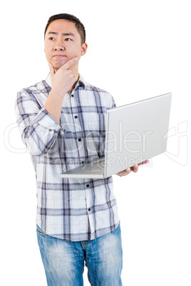 Thoughtful man holding laptop