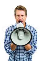 Portrait of angry man shouting through megaphone