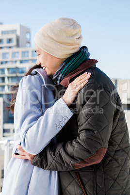 Cheerful couple hugging each other