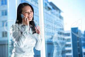 Smiling businesswoman on phone call