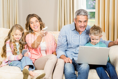 Happy family sitting at home