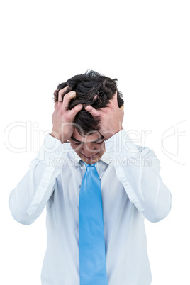 Irritated asian businessman holding his head