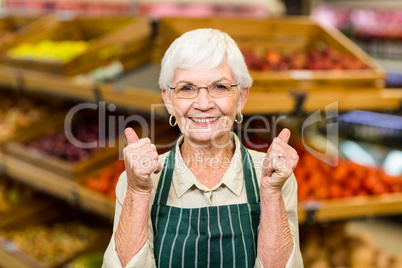 Senior female worker with thumbs up