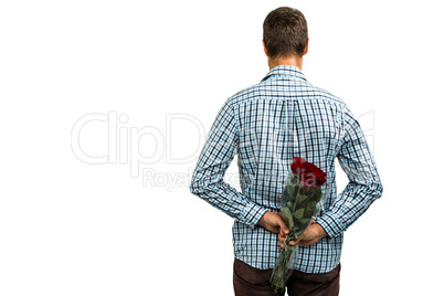 Rear view of man hiding roses