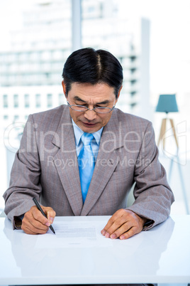 Serious businessman on his desk