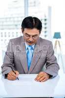 Serious businessman on his desk